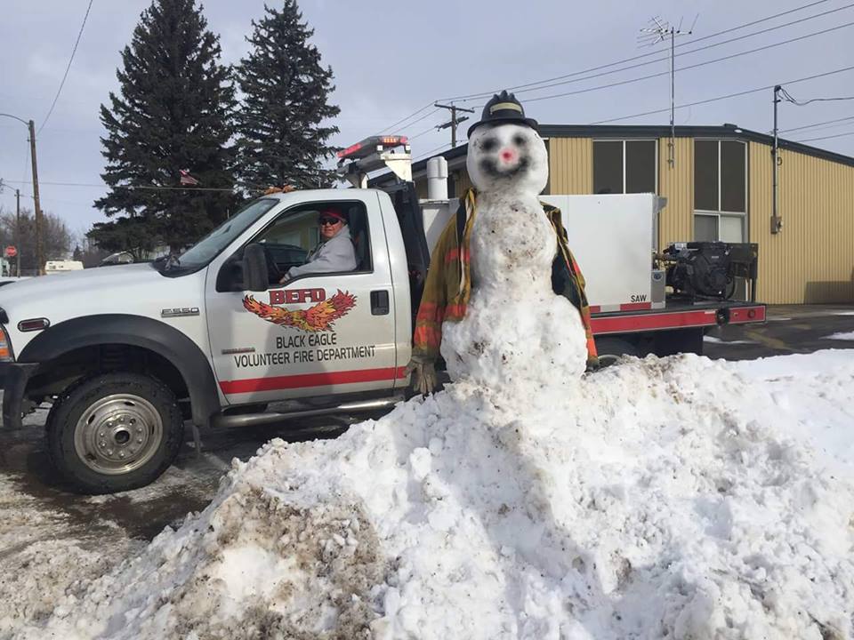 Snowman and volunteer fire department
